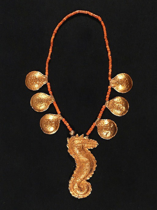cc10a: Gold foil wrapped amulets on beaded necklace.  19th century.  Minangkabau, Sumatra Island, Indonesia.